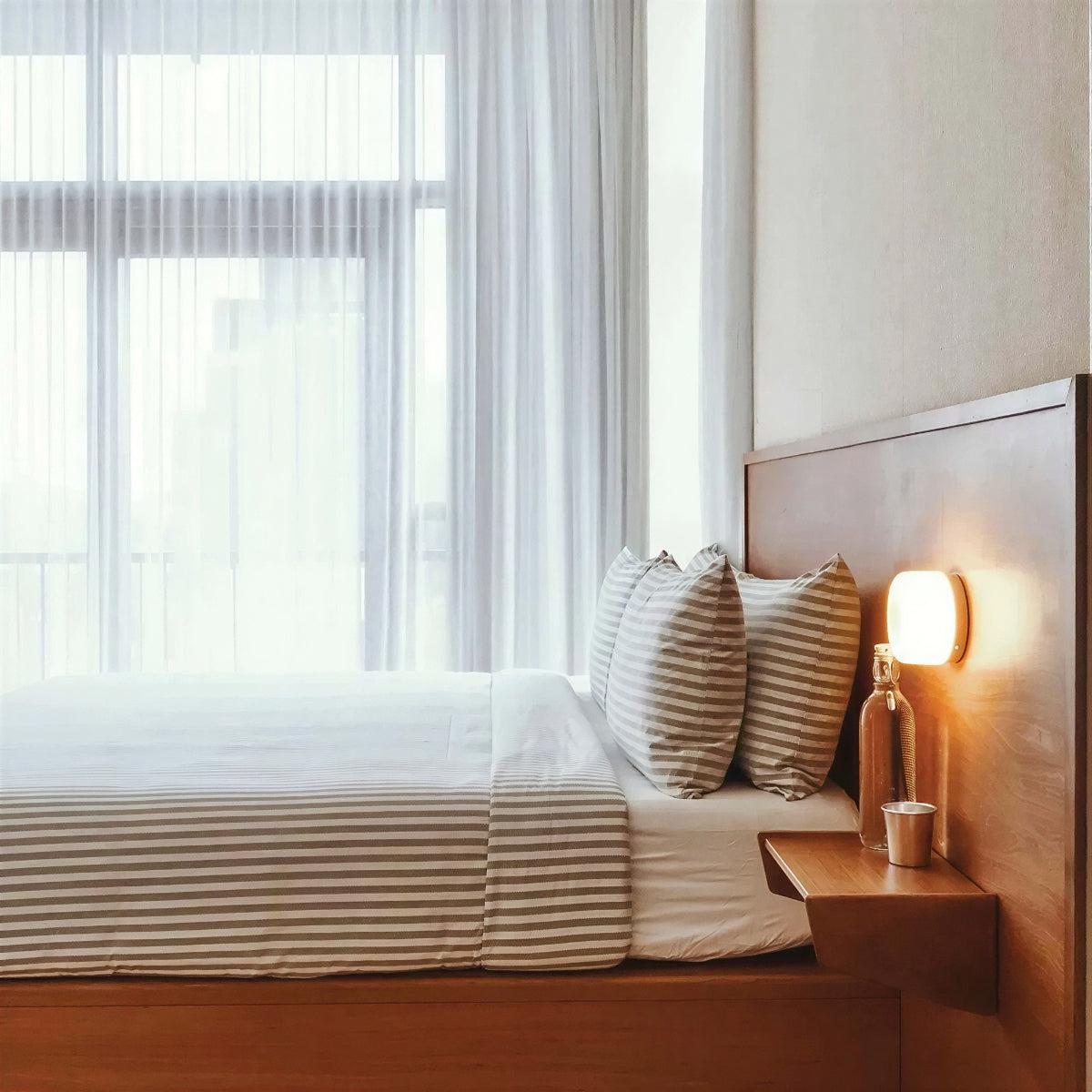 Dimple Wall Sconce Light With Ambient Glow and Round Design
